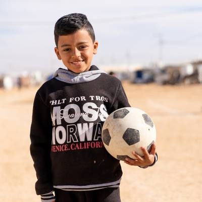 child with football